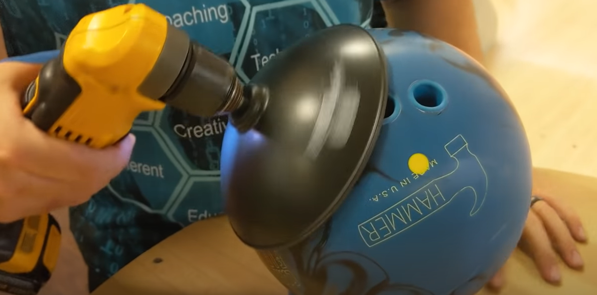 cleaning and polishing bowling ball with spinner